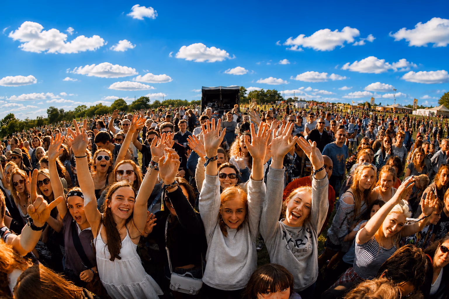 LodeStar Festival crowd in front of stage photograph on a bright sunny day.